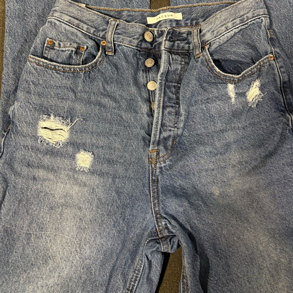 Distressed Blue Denim Jeans